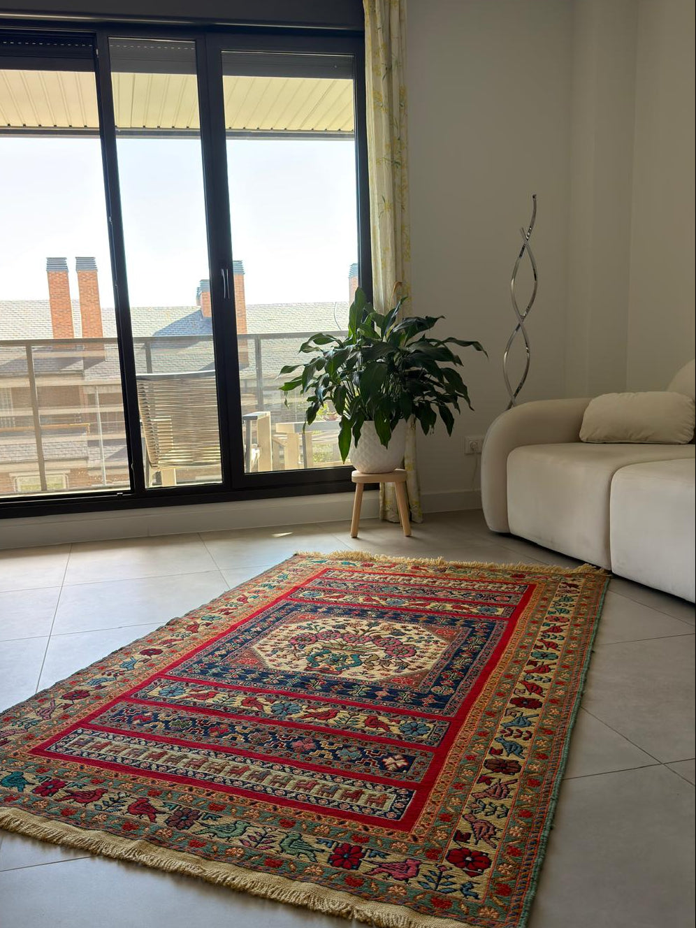 Decorative rug with intricate patterns in a modern living room.
