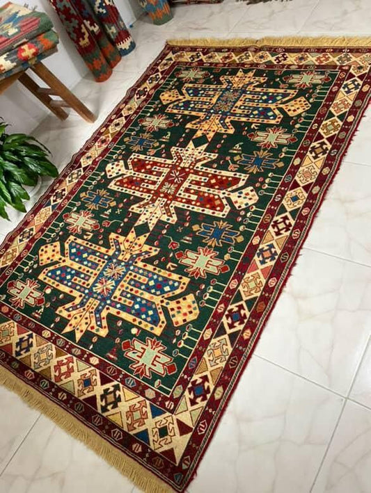 Decorative rug with intricate patterns on a tiled floor