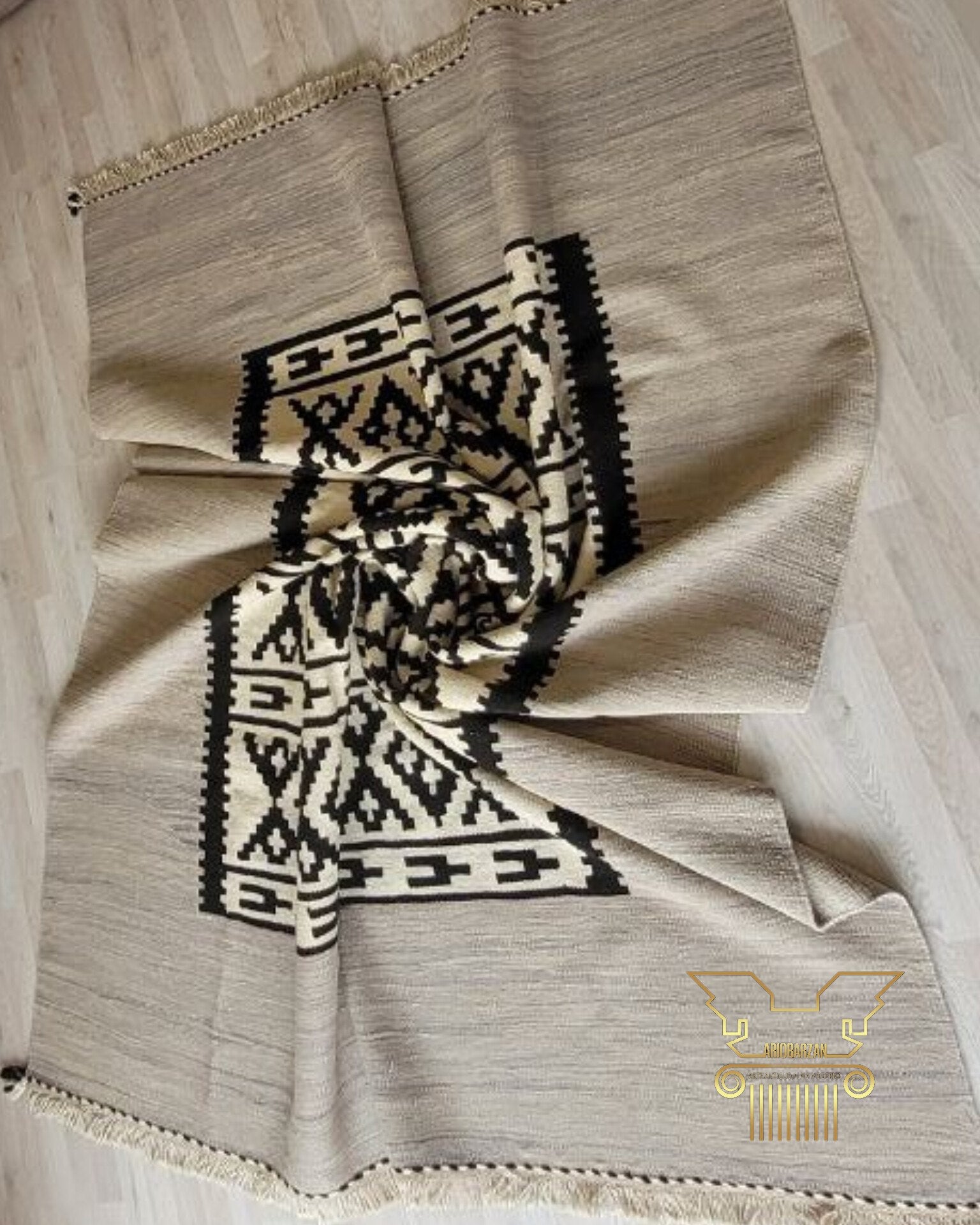 Textile with geometric pattern on a wooden surface